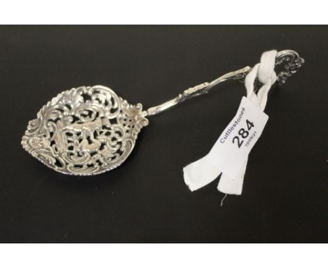A CONTINENTAL STYLE WHITE METAL SPOON WITH  PIERCED BOWL, FEATURING THE DEVIL SACRIFICING A GOAT, APPROX WEIGHT 40.3 G