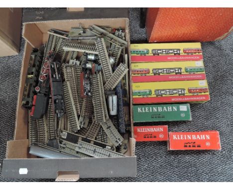 A box of Marklin 00 gauge including 4-6-2 Loco &amp; Tender, Deutsche Bundesbahn Locomotive, Rolling Stock, Track et along wi