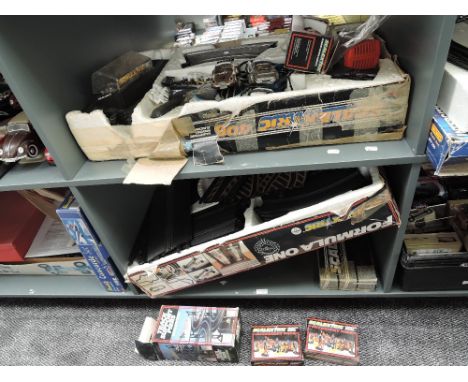 Two shelves of 1990's Scalextric including Formula One part set, 400 part set, Track Support Piers, C706 Accessory Pack x2, p