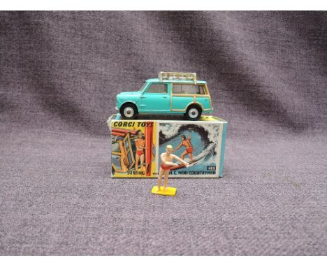 A Corgi diecast, 485 Surfing with the B.M.C Mini Countryman in light green with yellow interior, surfer present, surf boards 