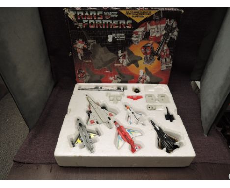 A 1985 Hasbro Takara Transformers Aerialbot Air Warrior Superion Set, comprising five smaller Transformers Silverbolt, Skydri