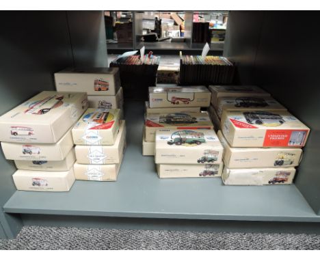 A shelf of Modern Corgi Classics diecast Buses, approx 26, all boxed