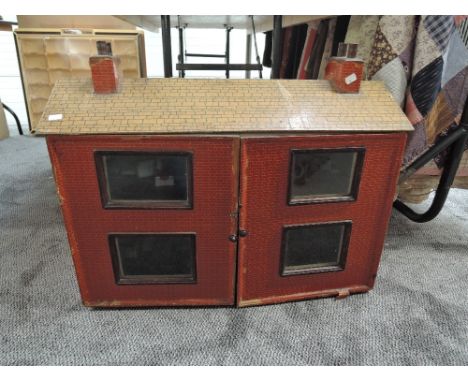 A vintage two storey Dolls House having four rooms and single staircase containing a small amount of furniture, height 60cm, 
