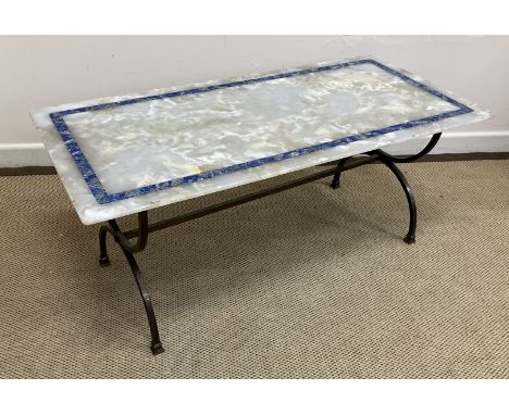 A 20th Century white onyx and lapis lazuli banded coffee table, the rectangular top with slightly tapered underside edge on a