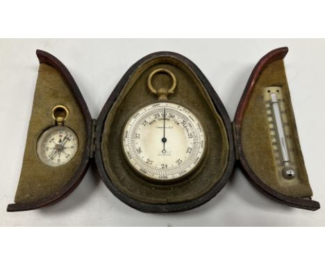 A circa 1900 gilt brass cased compensated barometer with silvered dial by The Army & Navy Cooperative Stores Ltd Westminster,