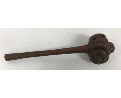 A Fiji throwing club Iula Mudu Melanesia with lobed head and domed finial, the tapered handle with zigzag grip and concave bu