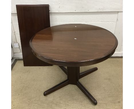A mid to late 20th Century Danish mahogany circular extending dining table on pedestal quadruped base, by H W Klein for Brami