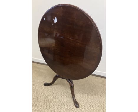 A 19th Century mahogany tea table, the circular snap top on a birdcage to baluster turned pedestal and acanthus carved cabrio