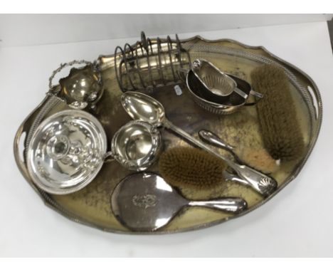 A collection of various plated wares to include two handled tray with pierced border, a plated sugar basin and matching cream