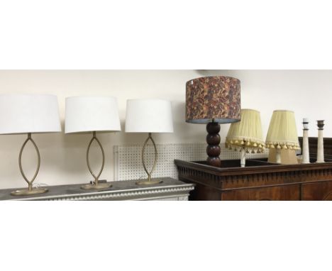 A set of three contemporary gold painted metal navette design table lamps and shades approx. 55 cm x 30 cm x 16 cm together w