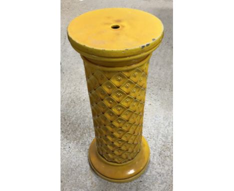 A late 19th Century Burmantofts yellow glazed pottery jardiniere stand, the circular top on a floral lozenge medallion decora