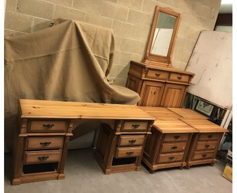 A suite of pine bedroom furniture including a set of four three drawer bedside chests, 64 cm wide x 46 cm deep x cm 62 cm hig