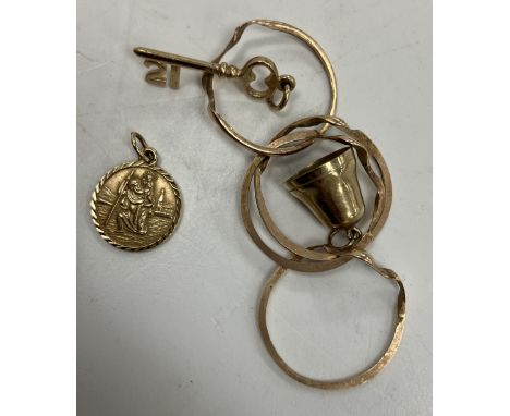 A small quantity of various 9 carat gold jewellery including a Russian type wedding ring in four sections, size R, St. Christ