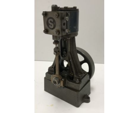 A small Stuart Turner No. 10V vertical steam engine 15 cm high.