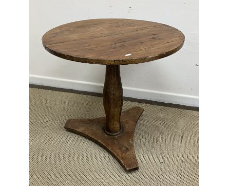 A Victorian walnut gypsy table, the circular pine top on a typical carved walnut tripod base, 61 cm wide x 72.5 cm high toget