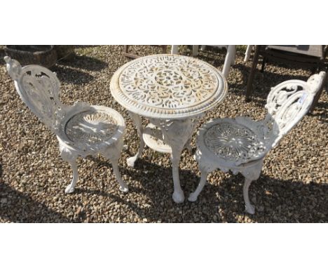 A cast iron Britannia style garden table and two chairs   CONDITION REPORTS  cRust is coming through the paintwork.  Paintwor