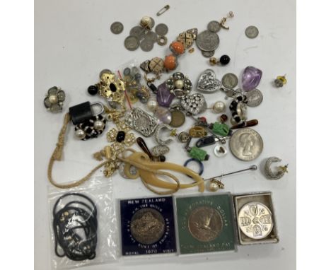 A small collection of various costume jewellery, earrings, pendants, coins, two polished amethyst stones, etc.