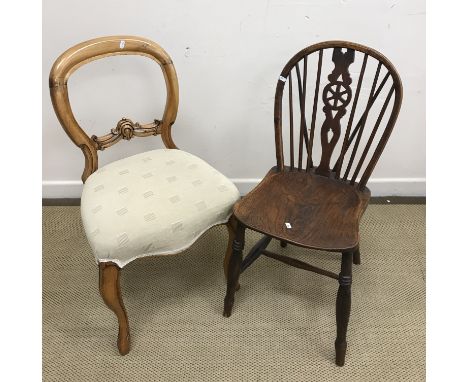 A 19th Century beech and elm Oxford bar back chair, a North Country rush seat spindle back chair, a Victorian balloon back ch