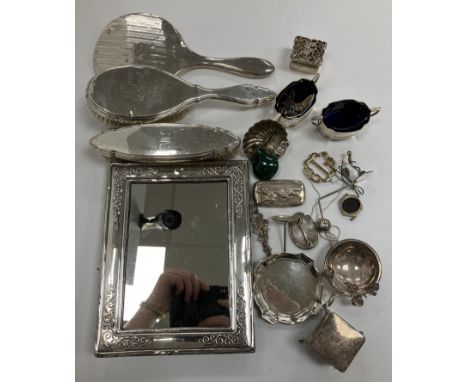 A modern embossed silver photo frame (by Francis Howard Ltd, Sheffield 1988) 17.5 cm x 22.5 cm, a silver backed hairbrush and