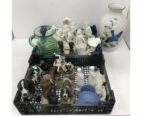 Two boxes containing various decorative china ware to include various blanc de chine figures, an etched glass jug with ship d