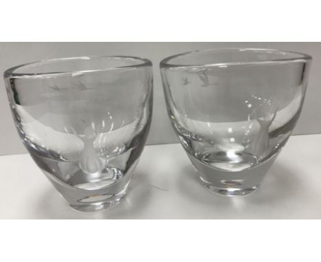A pair of mid 20th Century Orrefors style vases, each engraved with young girl with her arms raised and two swans, indistinct