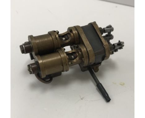 A Stuart Turner type single acting piston valve high speed engine 8.5 cm long.