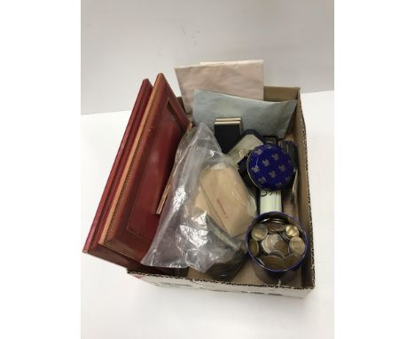 A box containing a selection of various sundry items including a bag of coins and notes of the Realm, a tin of similar, three