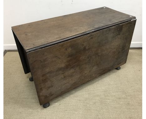 An early 19th Century oak rectangular drop leaf dining table on turned legs to pad feet, 158 cm x 111.5 cm x 68.5 cm high tog