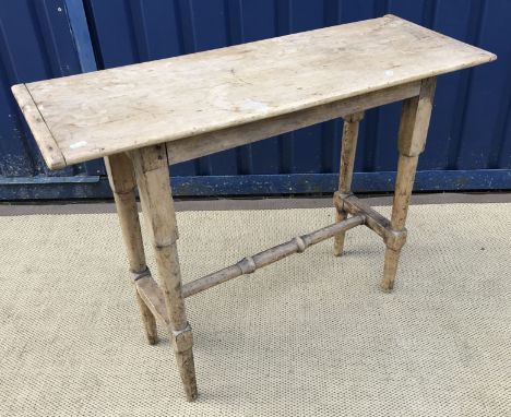 A 19th Century pine slim side table on turned legs united by stretchers, 97 cm wide x 36 cm deep x 75.5 cm high, a needlework