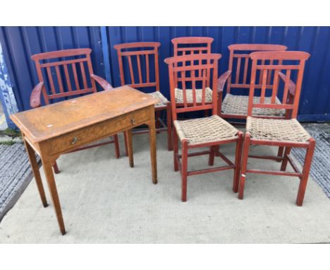 A set of six mid 20th Century red painted wrigglework decorated framed dining chairs, with rush seats, on square supports uni