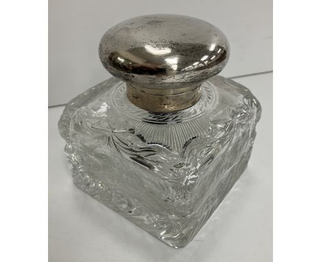 A George V heavy cut glass inkwell of square form with silver mounts (maker's mark obscured ..... & Sons, London 1913), 11 cm