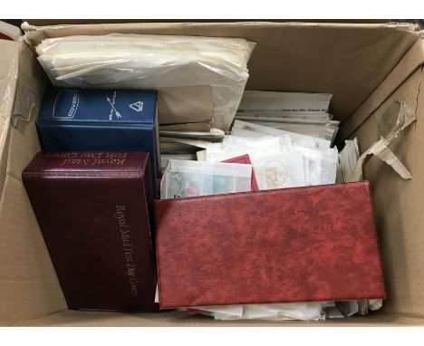 Two boxes containing a collection of mainly First Day Covers in albums and loose 