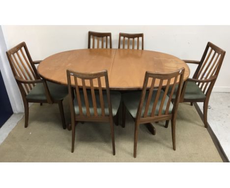 A G Plan teak D end dining table on end pillar supports to curved feet united by a centre stretcher 162 cm long x 106 cm wide