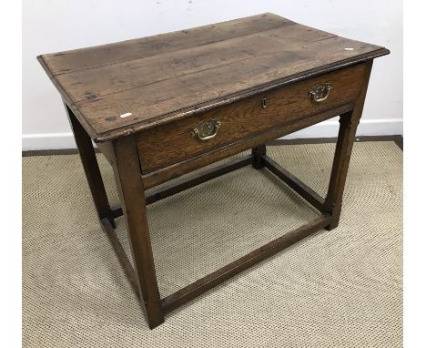 A 19th Century oak side table, the plank top with moulded edge over a single frieze drawer on square chamfered supports to bl