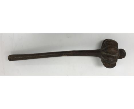 A Fiji throwing club Iula Mudu Melanesia with lobed head and domed finial, the tapered handle with zigzag grip and concave bu
