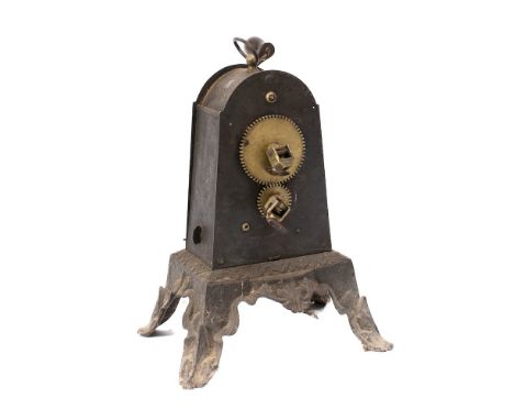 A 19th Century Continental clockwork spit engine: in domed blackened metal casing on a cast iron base with four splayed feet.