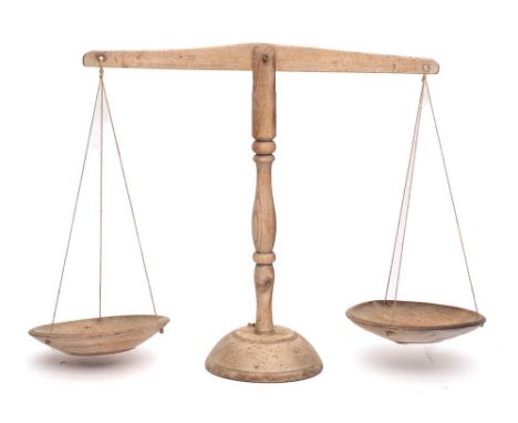 A set of fruitwood dairy scales: with turned ash central stem and twin circular pans.