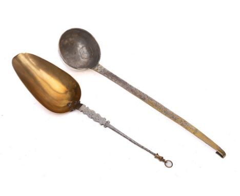 A white metal and brass hanging ladle: with hooked end, decorated handle and circular bowl, also a brass and steel hanging sp