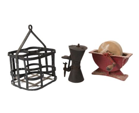 A stone knife grinder: in an iron table stand with turned wood handle, an iron four-bottle carrier and a tin coffee grinder w