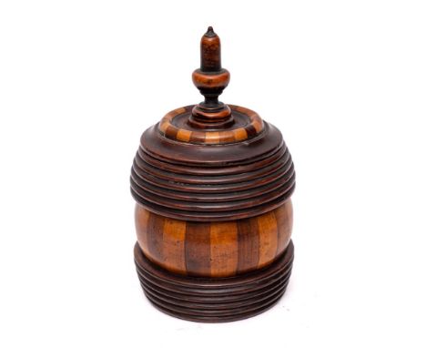 A lignum vitae biscuit barrel and cover: with acorn finial, ribbed and simulated fluted sides and interior plated cover, 24.5