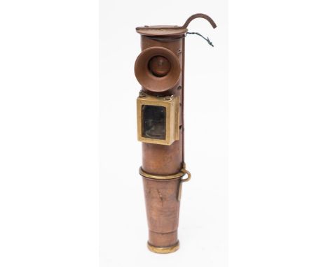 An unusual copper signalling lamp: of telescope design with brass framed hinged sighting cover, 24cm high.