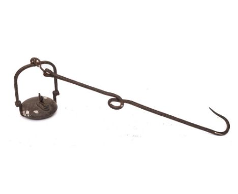 A French iron hanging oil lamp:, the circular font surmounted by a cockerel on a scrolled hook, 76cm long.