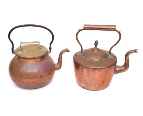 A 19th Century Dutch copper kettle: with brass lid and iron handle, also a 19th Century copper kettle and lid with acorn fini