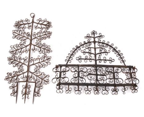 A decorative wrought iron wall mounted rack: of domed outline with five hooks, 52cm high x 59cm wide, also a decorative wroug