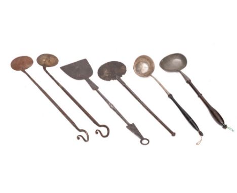 A pewter ladle: with turned wood baluster handle, a Continental white metal ladle with turned ebonised wood handle, a copper 