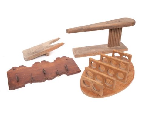 A long narrow beechwood trough:, 104cm long, a spruce wall rack with fret cut top and base and five iron hooks, 37.5cm wide, 