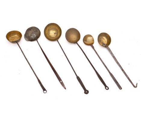 A collection of six brass ladles, pans: and a single sieve lipped ladle. (6)