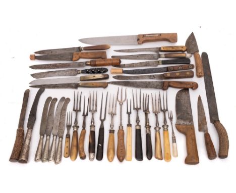 A collection of carving knives and forks:, variously handled, also four Continental silver handled table knives and a carving