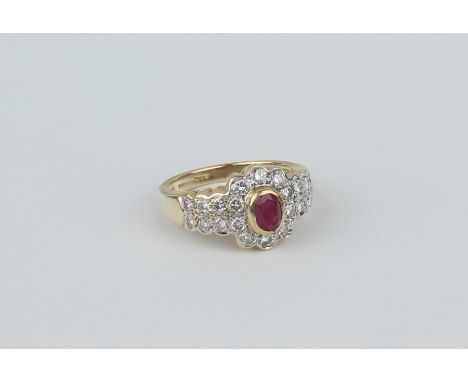 An 18ct gold ruby and diamond cluster ring