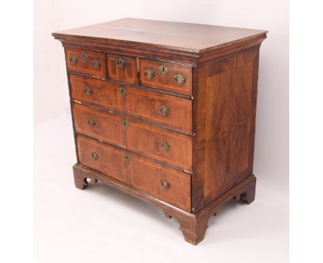 A George I and later crossbanded walnut chest of drawers - probably originally the top of a chest-on-chest, the broadly cross